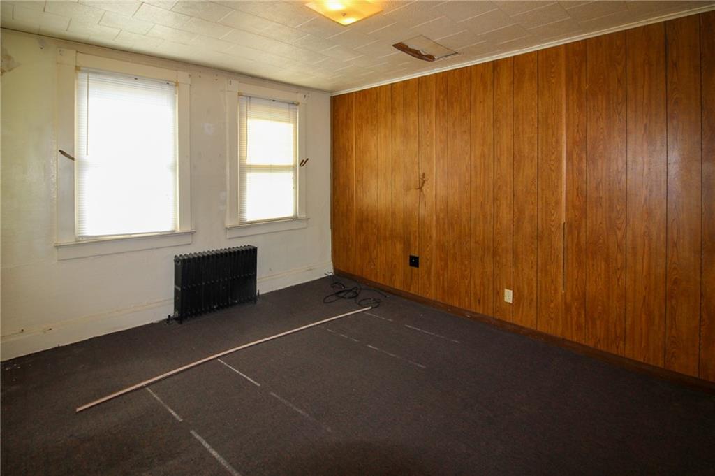 244 Center Street Springdale, PA 15144 - Photo 22 of 32 a view of an empty room with a window