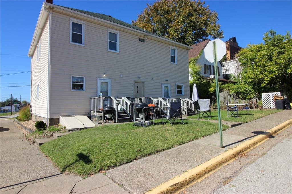 244 Center Street Springdale, PA 15144 - Photo 30 of 32 a front view of a house with a yard