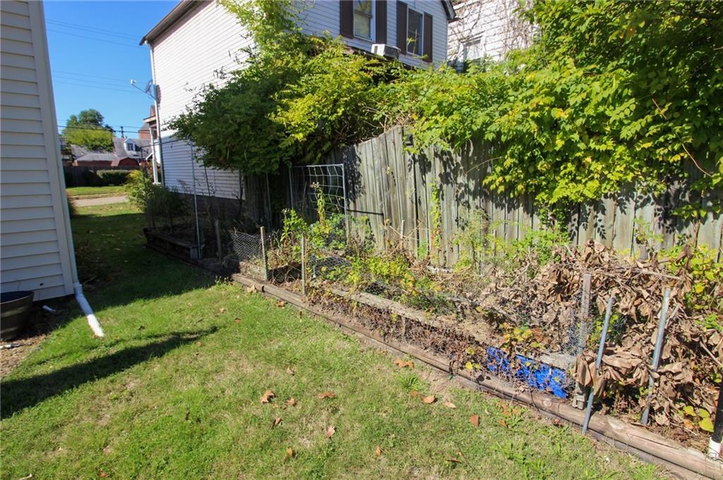 244 Center Street Springdale, PA 15144 - Photo 32 of 32 a backyard of a house with lots of green space