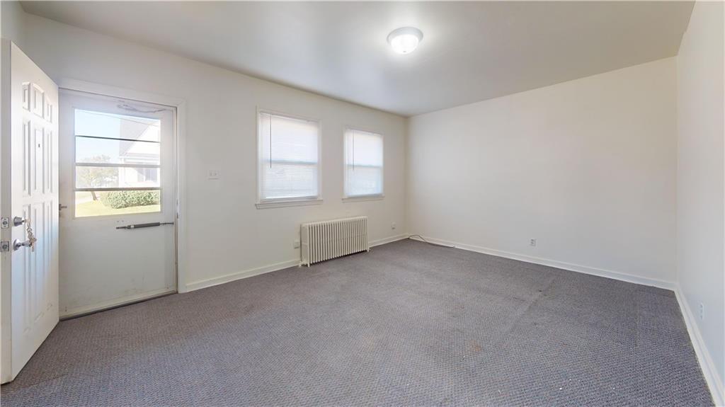 244 Center Street Springdale, PA 15144 - Photo 4 of 32 an empty room with windows