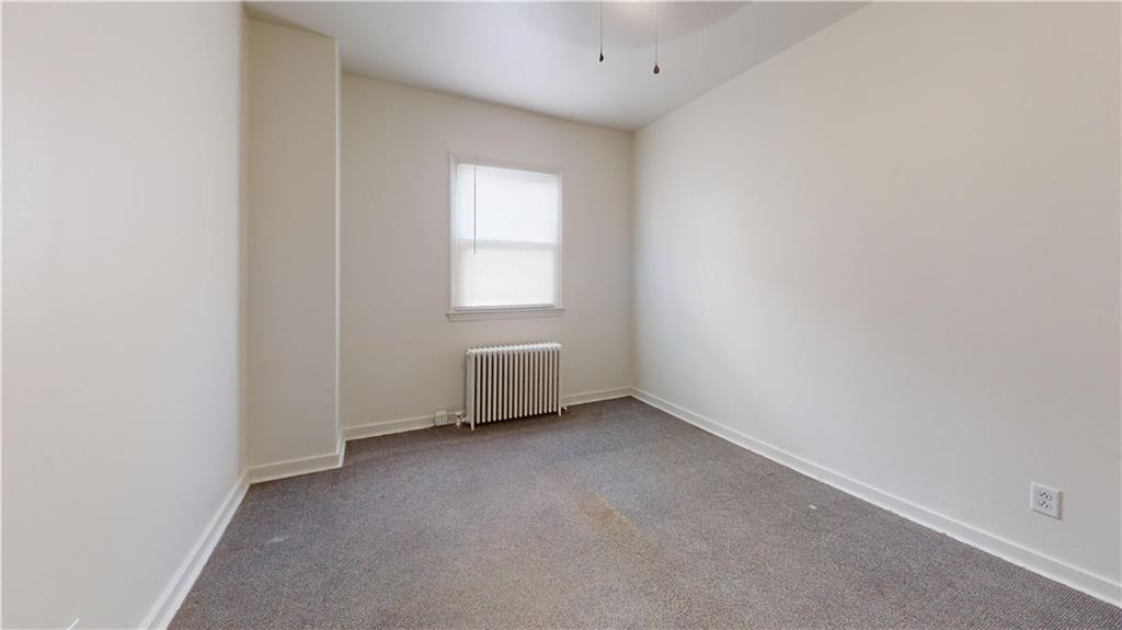 244 Center Street Springdale, PA 15144 - Photo 5 of 32 an empty room with a window