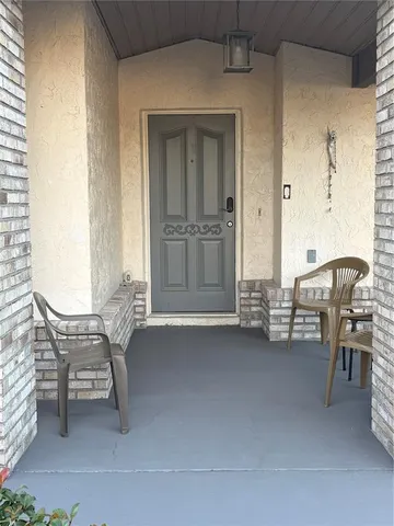 a view of a livingroom with furniture and windows
