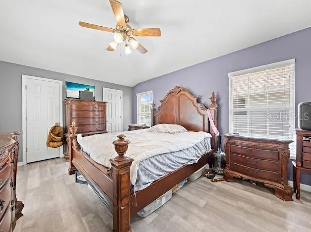 a bed room with a bed and a window