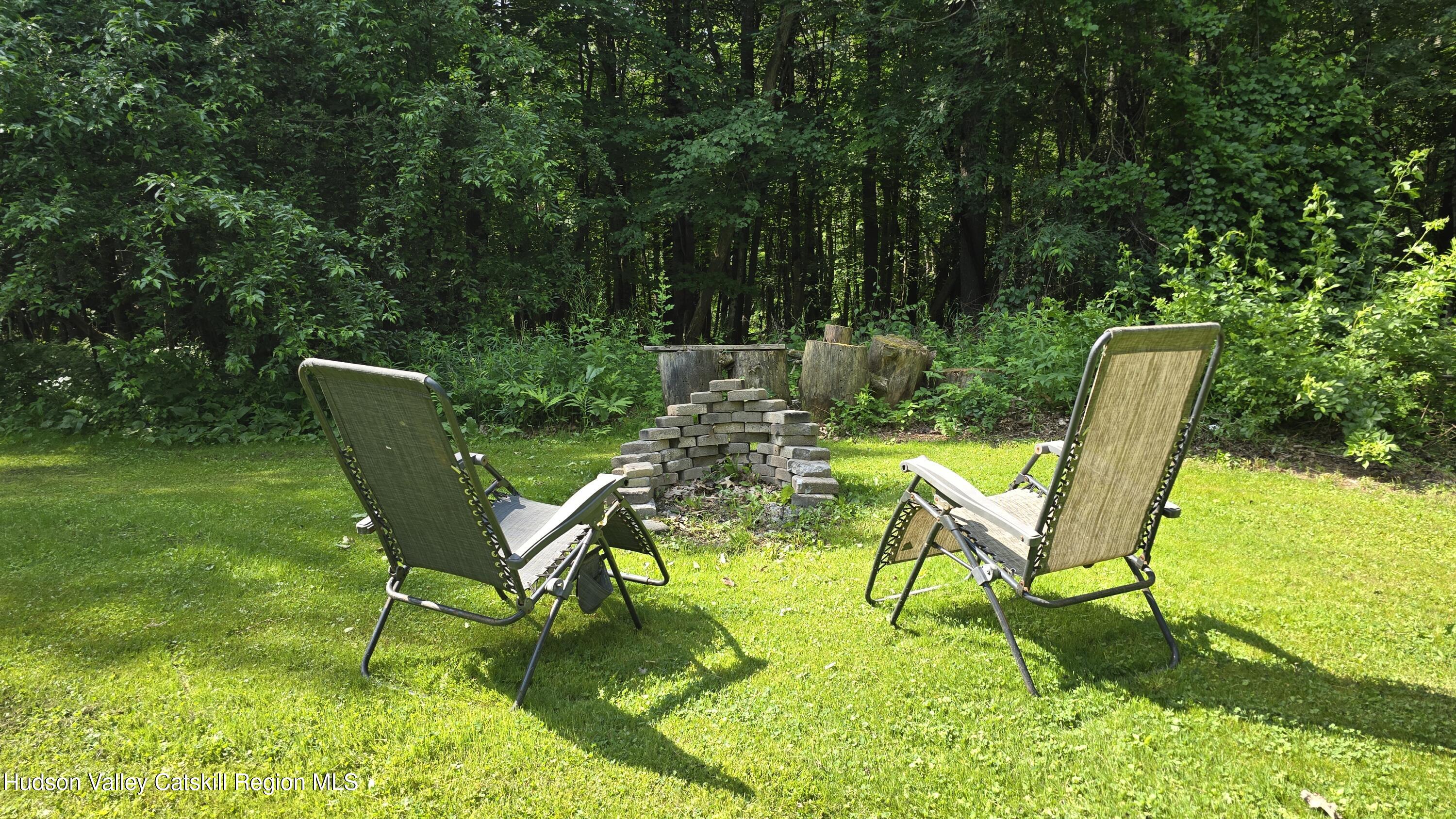 3620 County Rte 9 East Chatham, NY 12060 - Photo 15 of 28 a view of a swimming pool with chair and garden