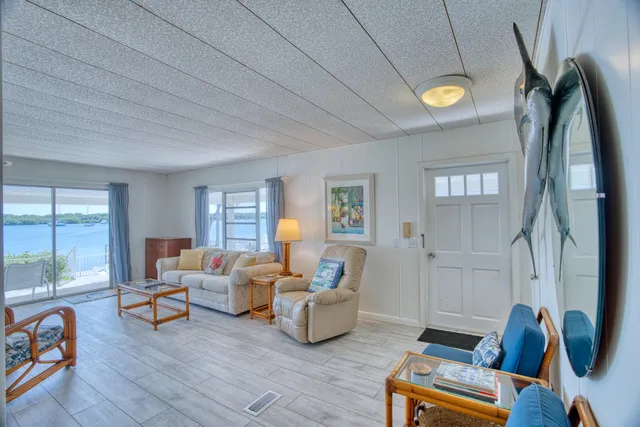 a living room with furniture toys and a window