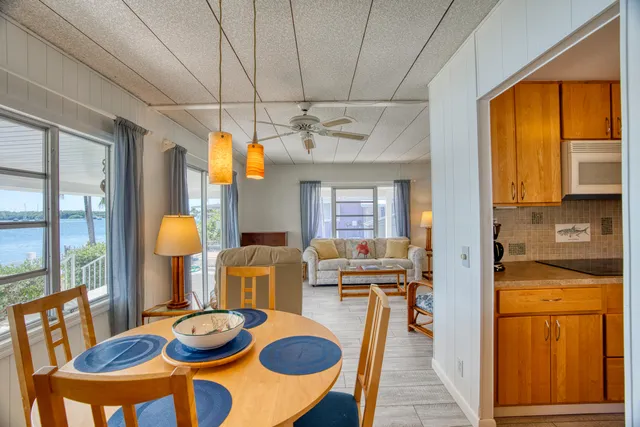 a kitchen with a sink a stove and cabinets