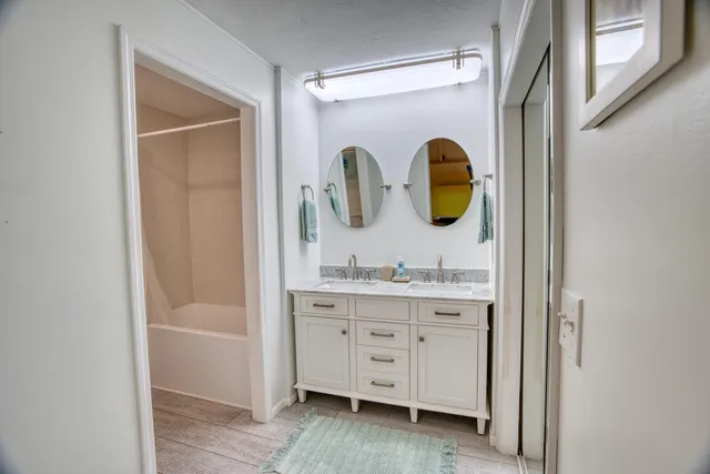a bathroom with a bathtub and shower