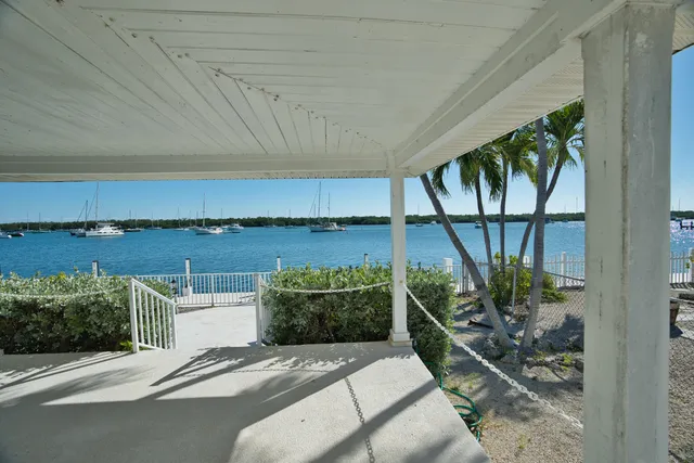 an aerial view of residential houses with outdoor space and street view