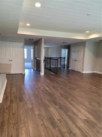 a view of a livingroom with wooden floor