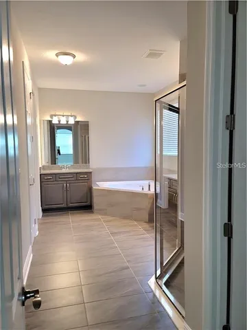 a view of a hallway and a livingroom with a furniture