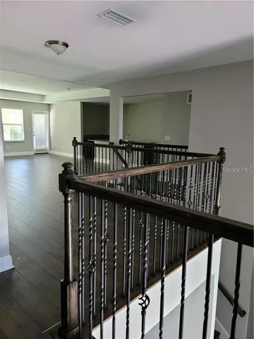 a view of entryway with wooden floor