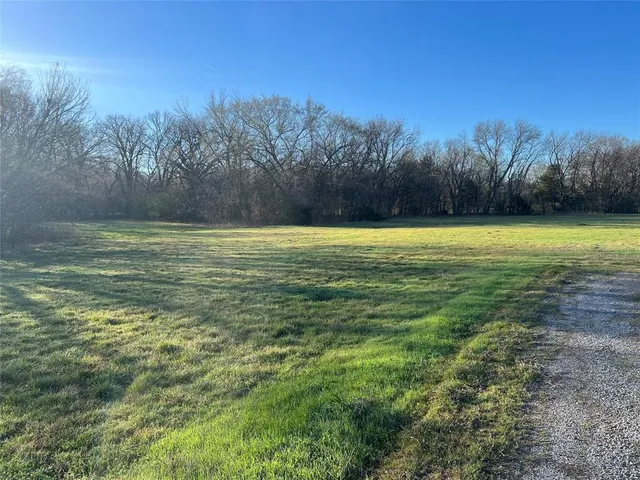 a view of a lake with a yard
