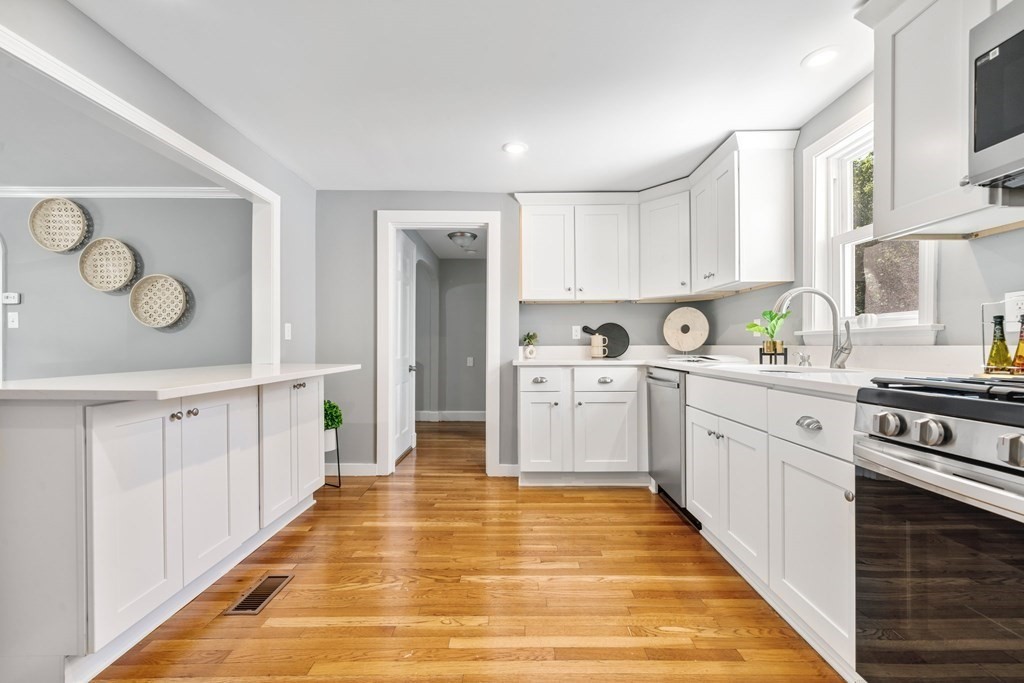 31 Terrace Drive Worcester, MA 01609 - Photo 11 of 42 a kitchen with white cabinets and white appliances