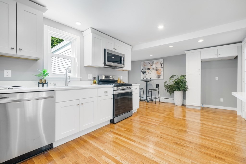 31 Terrace Drive Worcester, MA 01609 - Photo 12 of 42 a kitchen with stainless steel appliances a white cabinets stove top oven and sink