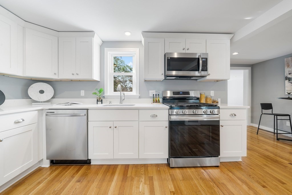 31 Terrace Drive Worcester, MA 01609 - Photo 13 of 42 a kitchen with a sink stove and microwave