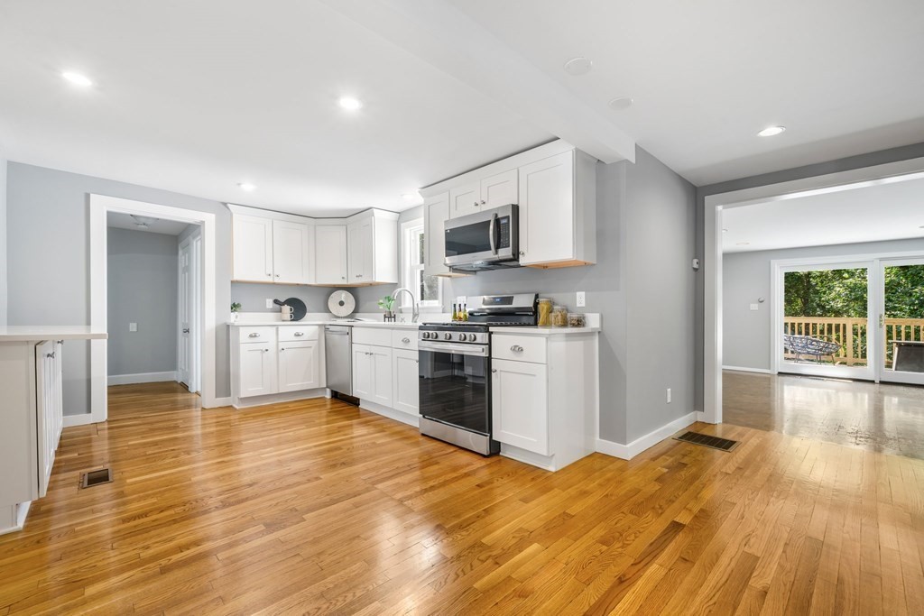31 Terrace Drive Worcester, MA 01609 - Photo 14 of 42 a kitchen with granite countertop a stove top oven and cabinets