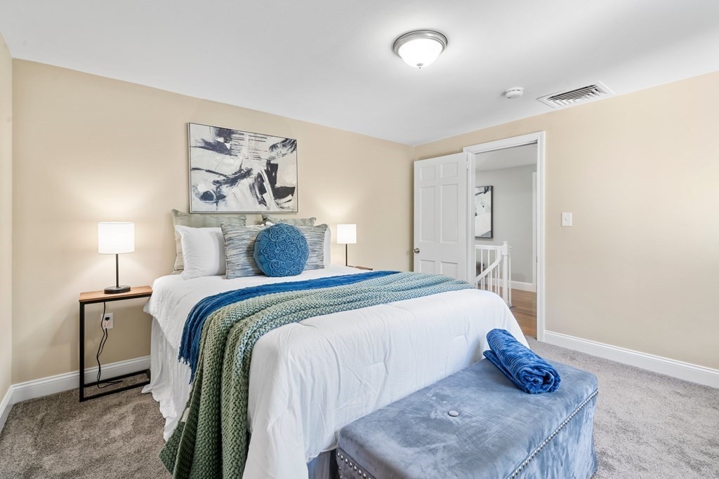 31 Terrace Drive Worcester, MA 01609 - Photo 21 of 42 a bedroom with a bed and lamp