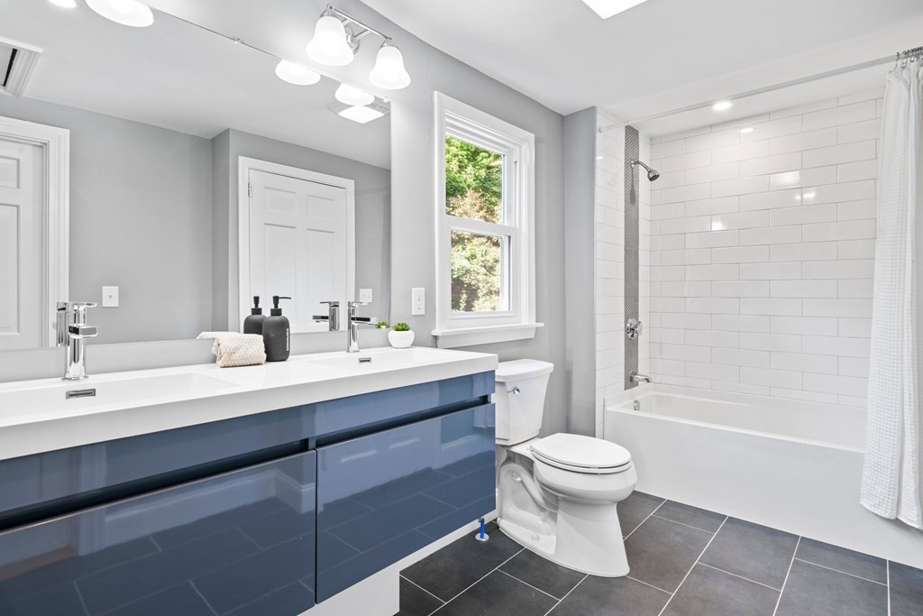 31 Terrace Drive Worcester, MA 01609 - Photo 29 of 42 a bathroom with a sink a toilet and a large mirror