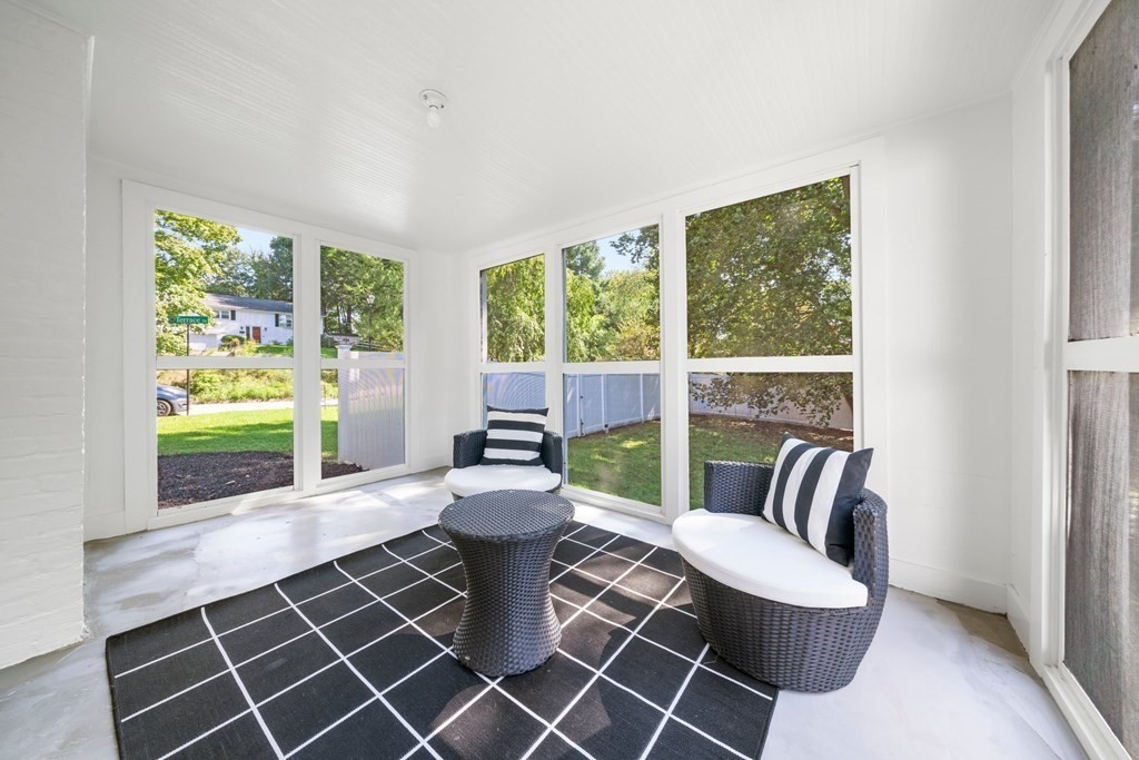 31 Terrace Drive Worcester, MA 01609 - Photo 7 of 42 a living room with furniture a floor to ceiling window and wooden floor