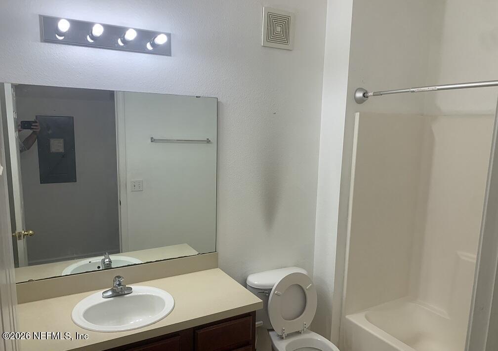 3631 Kirkpatrick Circle, Unit 6 Jacksonville, FL 32210 - Photo 11 of 14 a bathroom with a sink and a mirror