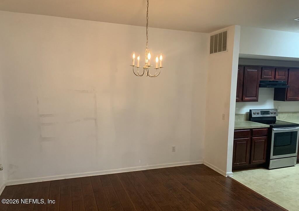 3631 Kirkpatrick Circle, Unit 6 Jacksonville, FL 32210 - Photo 3 of 14 a view of a kitchen with an empty space and a window