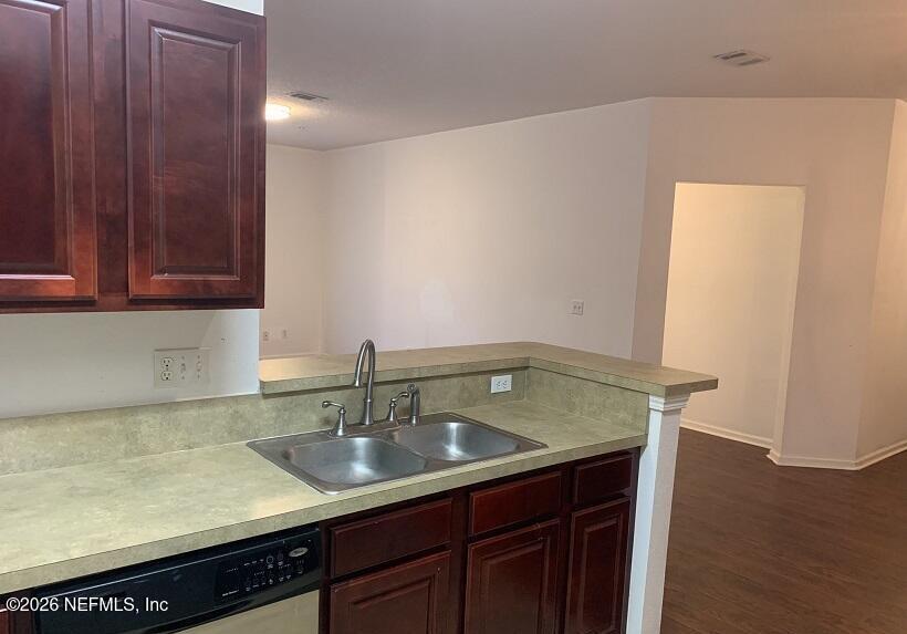 3631 Kirkpatrick Circle, Unit 6 Jacksonville, FL 32210 - Photo 5 of 14 a kitchen with a sink and cabinets