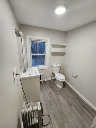 a room with a chair and a window