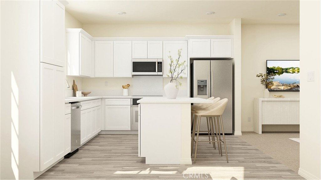 1791 Hornet Road Rialto, CA 92376 - Photo 2 of 16 a kitchen with a sink stainless steel appliances and white cabinets