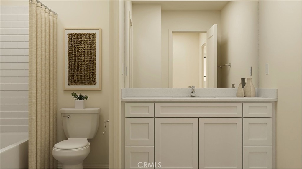 1791 Hornet Road Rialto, CA 92376 - Photo 8 of 16 a bathroom with a toilet a sink and mirror