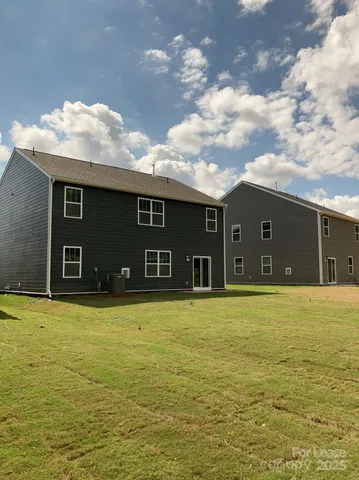 a house view with swimming pool
