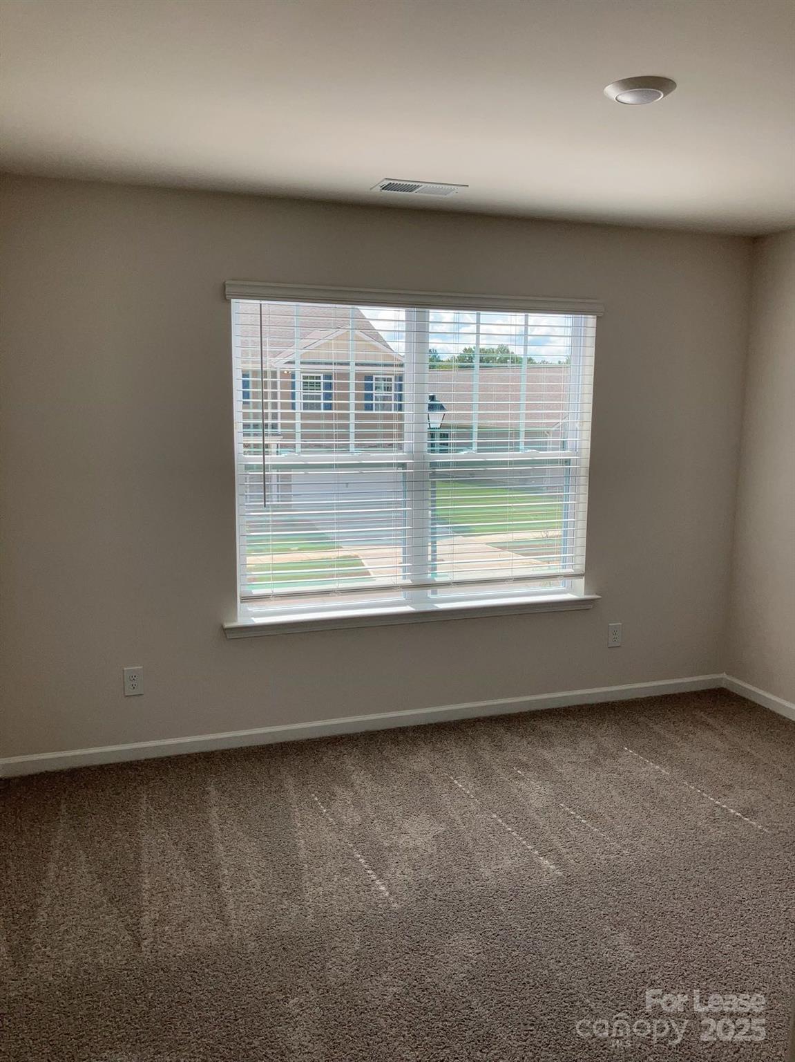 1834 Vanderlyn Street Monroe, NC 28112 - Photo 7 of 18 an empty room with a window