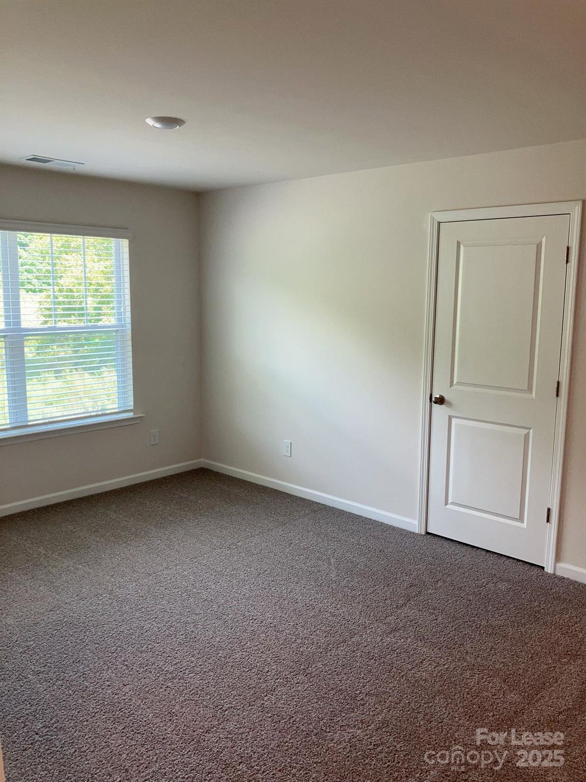 1834 Vanderlyn Street Monroe, NC 28112 - Photo 9 of 18 an empty room with a window