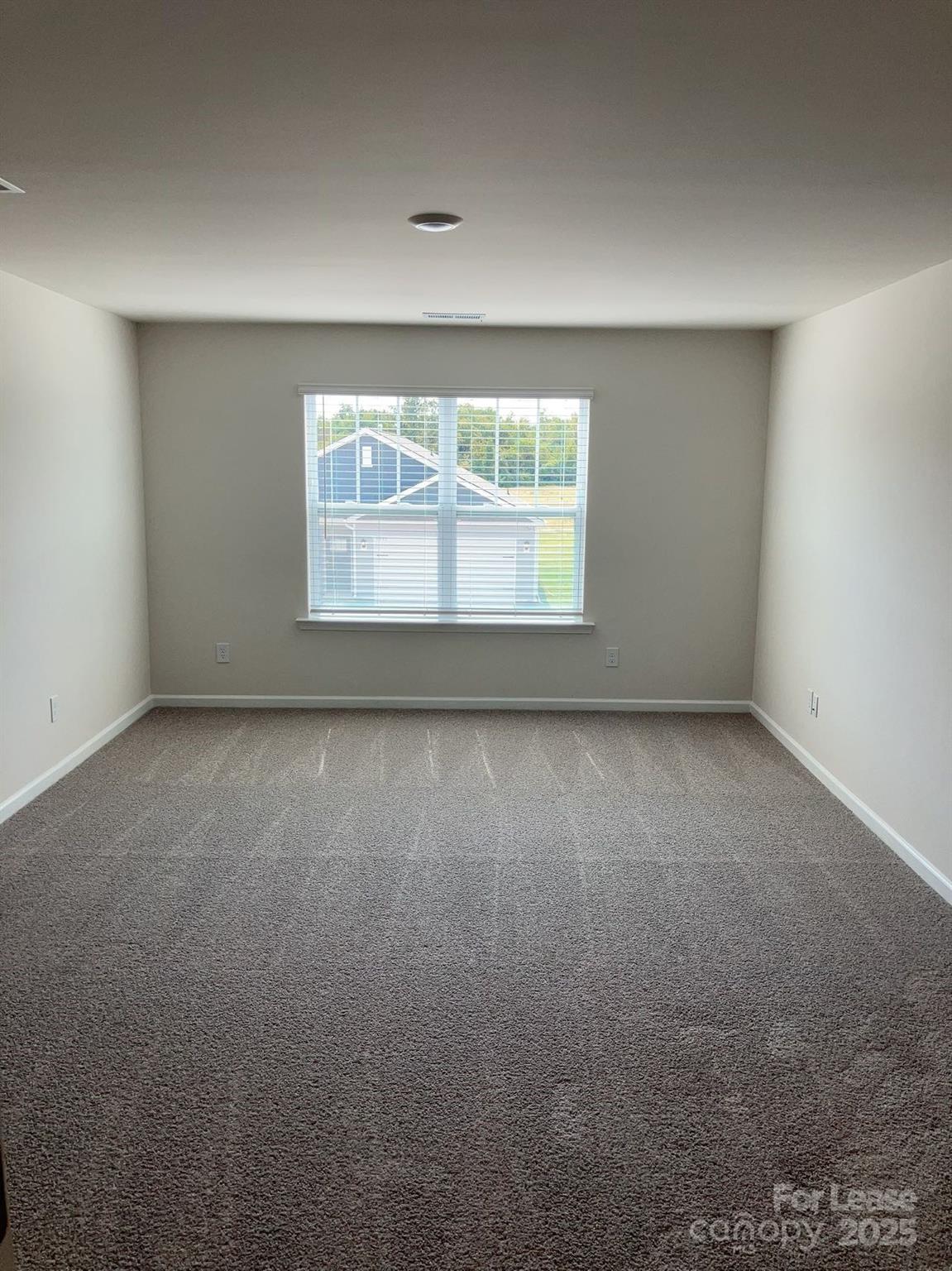 1834 Vanderlyn Street Monroe, NC 28112 - Photo 10 of 18 an empty room with a window