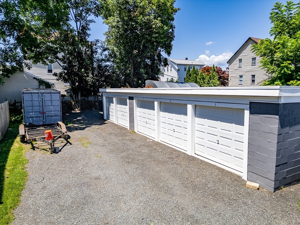 311 South Oxford Street Fall River, MA 02721 - Photo 2 of 11 a view of a chair and tables in the back yard of the house