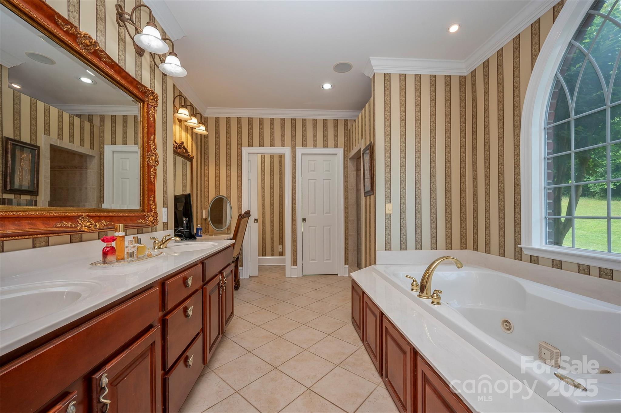 147 Pumkin Patch Road Rutherfordton, NC 28139 - Photo 13 of 47 a bathroom with a tub a sink and a large mirror