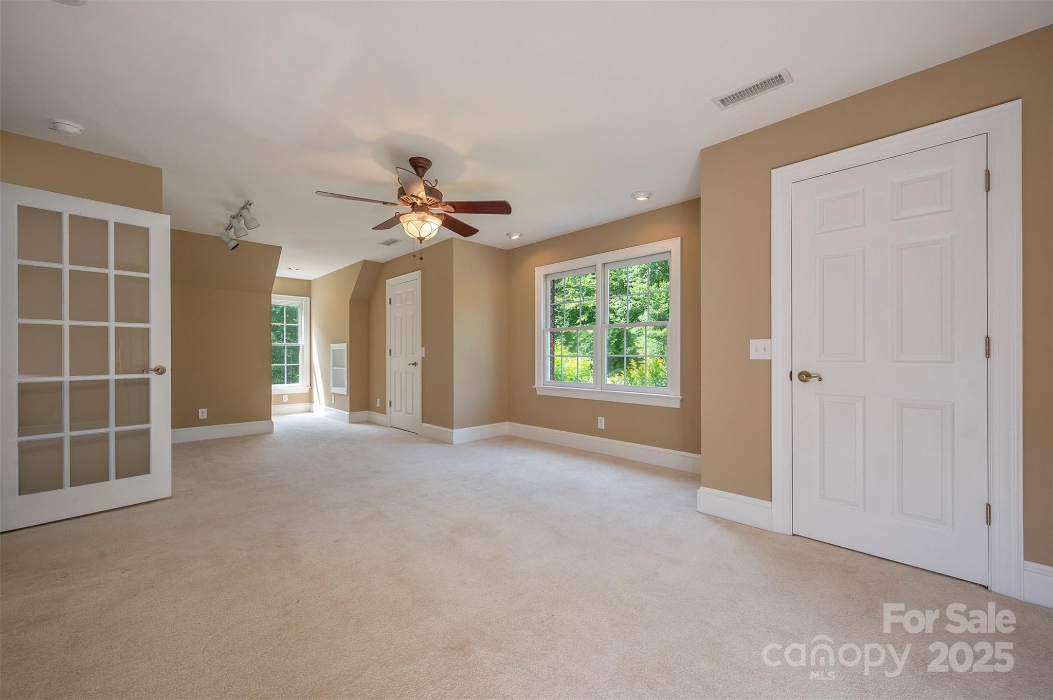 147 Pumkin Patch Road Rutherfordton, NC 28139 - Photo 25 of 47 an empty room with windows and ceiling fan