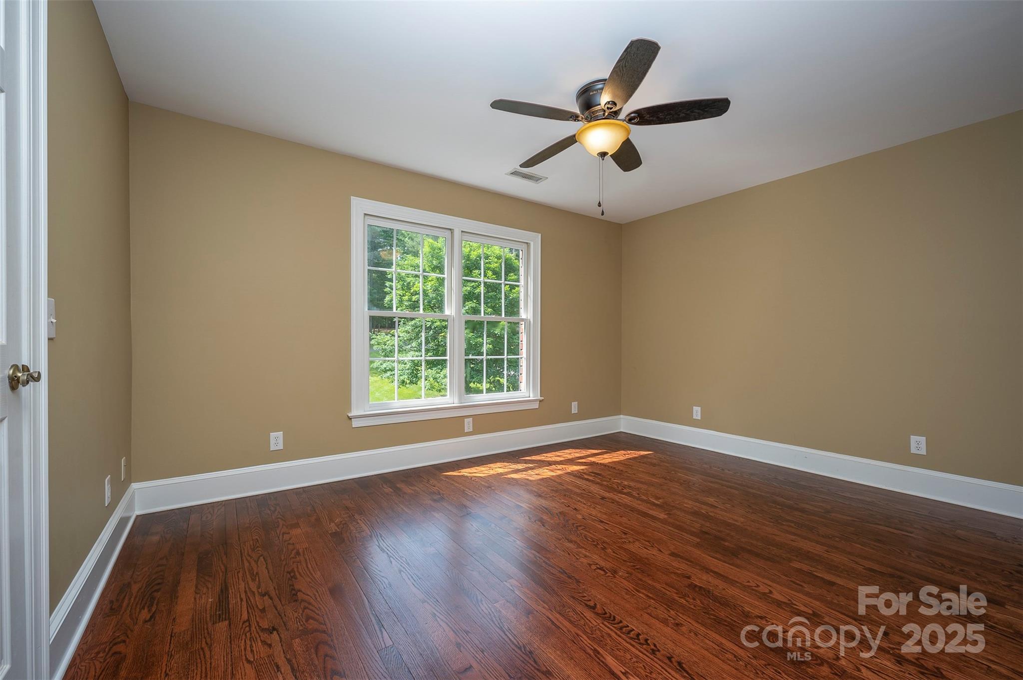 147 Pumkin Patch Road Rutherfordton, NC 28139 - Photo 26 of 47 a view of an empty room with wooden floor and a window