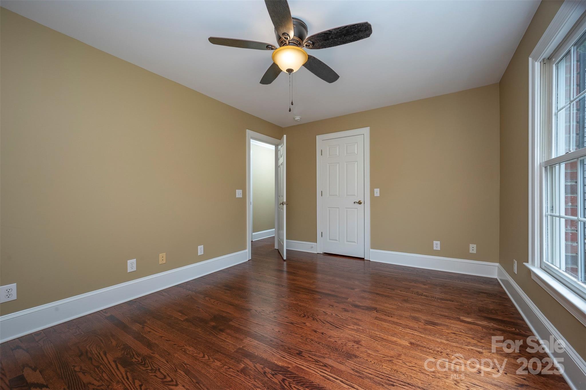 147 Pumkin Patch Road Rutherfordton, NC 28139 - Photo 27 of 47 a view of an empty room with window and wooden floor