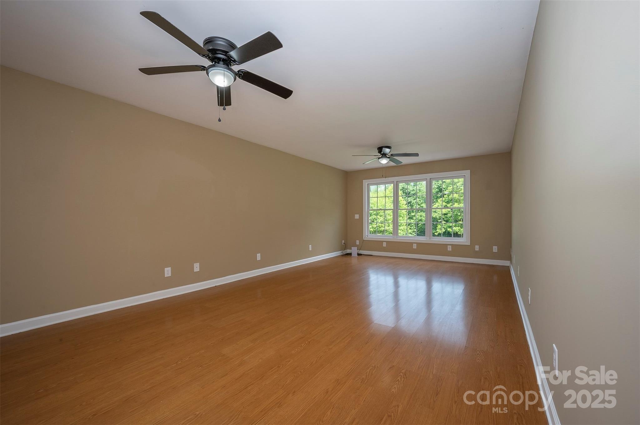 147 Pumkin Patch Road Rutherfordton, NC 28139 - Photo 32 of 47 an empty room with wooden floor and windows