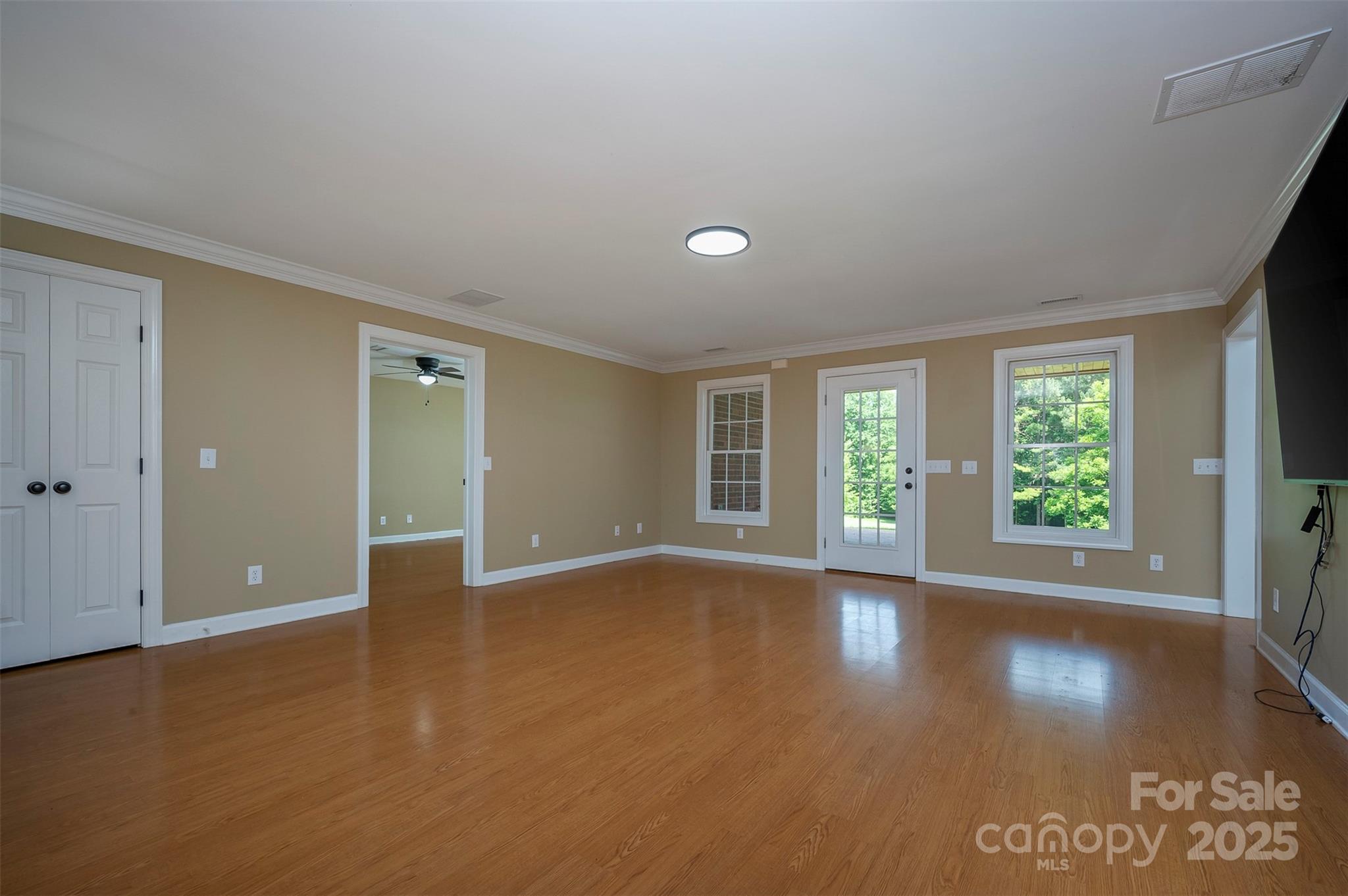 147 Pumkin Patch Road Rutherfordton, NC 28139 - Photo 36 of 47 a view of an empty room with wooden floor and a window