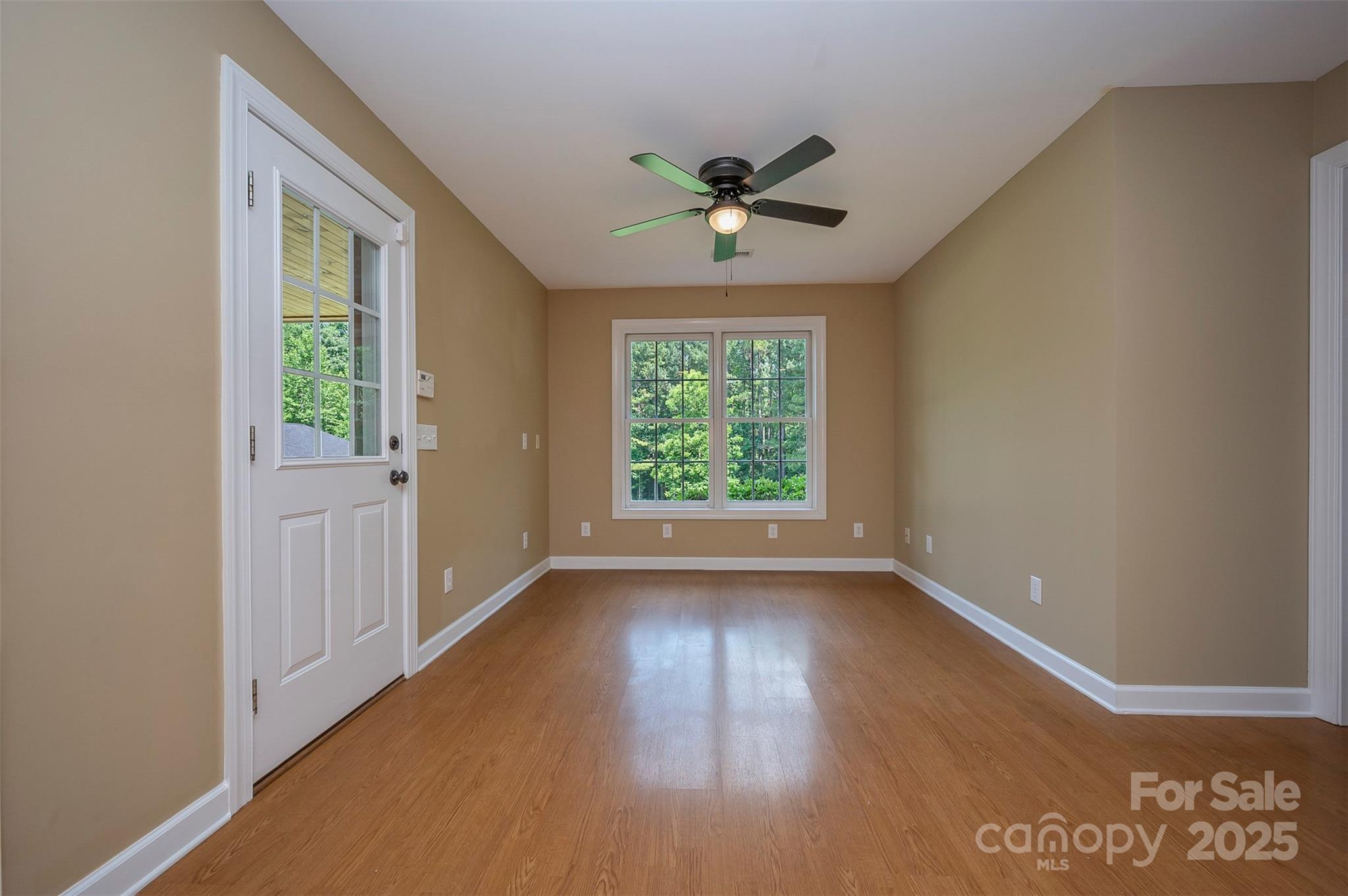 147 Pumkin Patch Road Rutherfordton, NC 28139 - Photo 38 of 47 a view of an empty room with a window and wooden floor