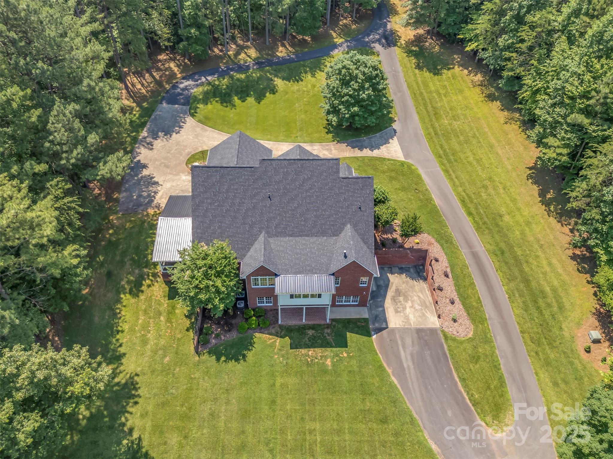 147 Pumkin Patch Road Rutherfordton, NC 28139 - Photo 41 of 47 an aerial view of a house with swimming pool and large trees