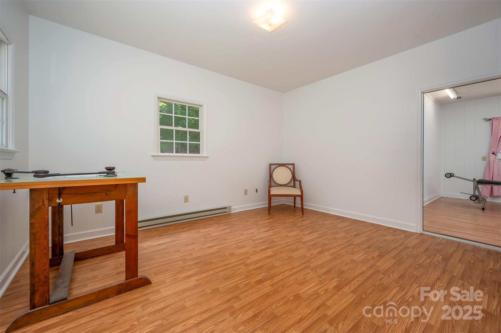 147 Pumkin Patch Road Rutherfordton, NC 28139 - Photo 44 of 47 a view of an empty room with wooden floor and a window