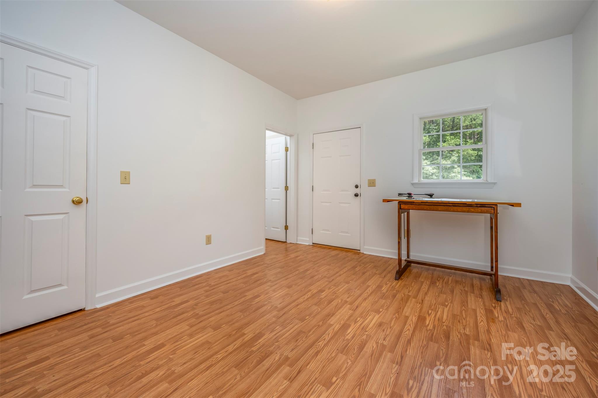 147 Pumkin Patch Road Rutherfordton, NC 28139 - Photo 45 of 47 a view of an empty room with wooden floor and a window