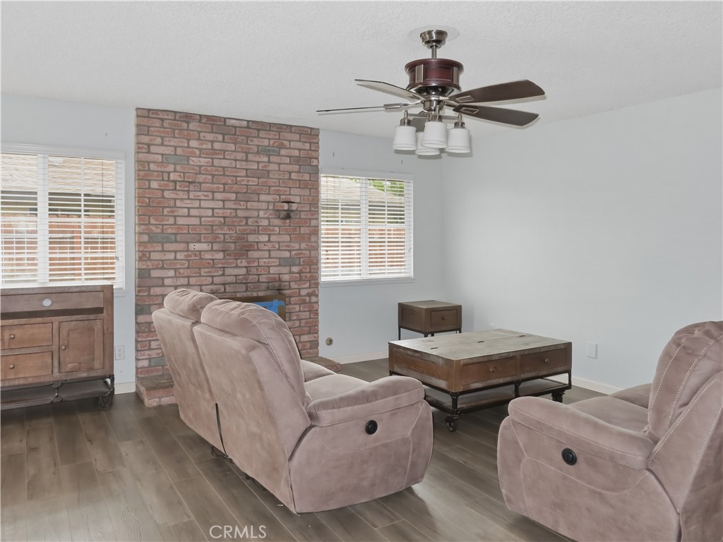 4409 Challen Avenue Riverside, CA 92503 - Photo 6 of 31 a living room with furniture and a fireplace