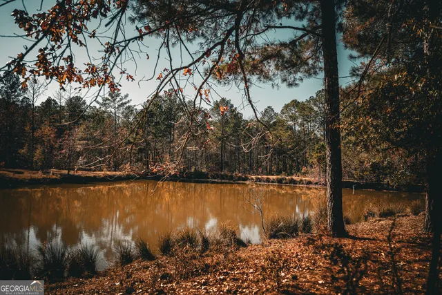 a view of a glass door with a yard from a window