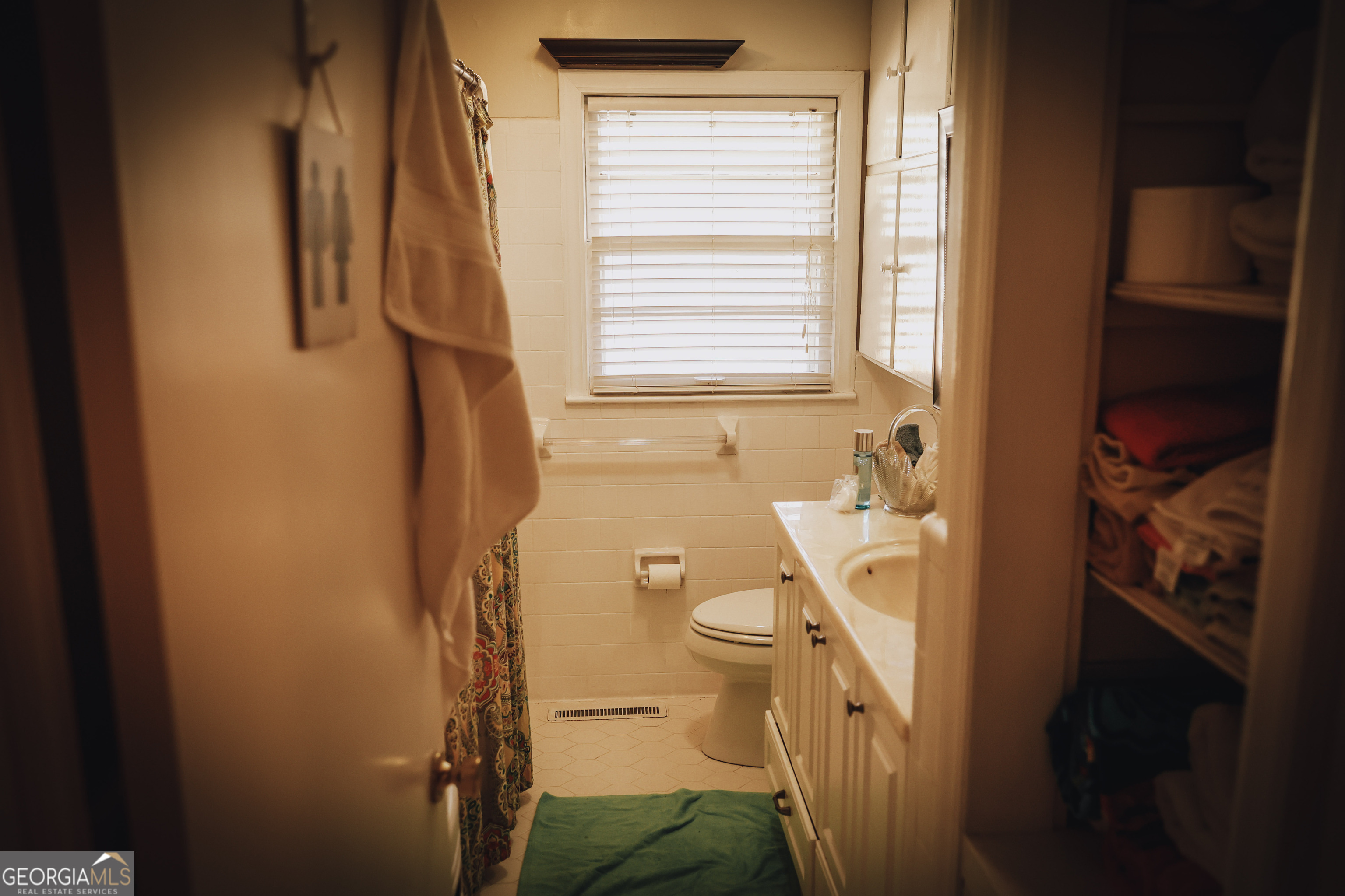 814 Oak Grove Church Road Musella, GA 31066 - Photo 25 of 55 a bathroom with a sink and a window