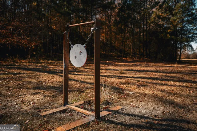 a bathroom with a bathtub and mirror