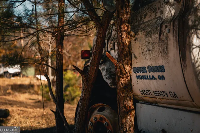 a view of a wooden house with a outdoor space
