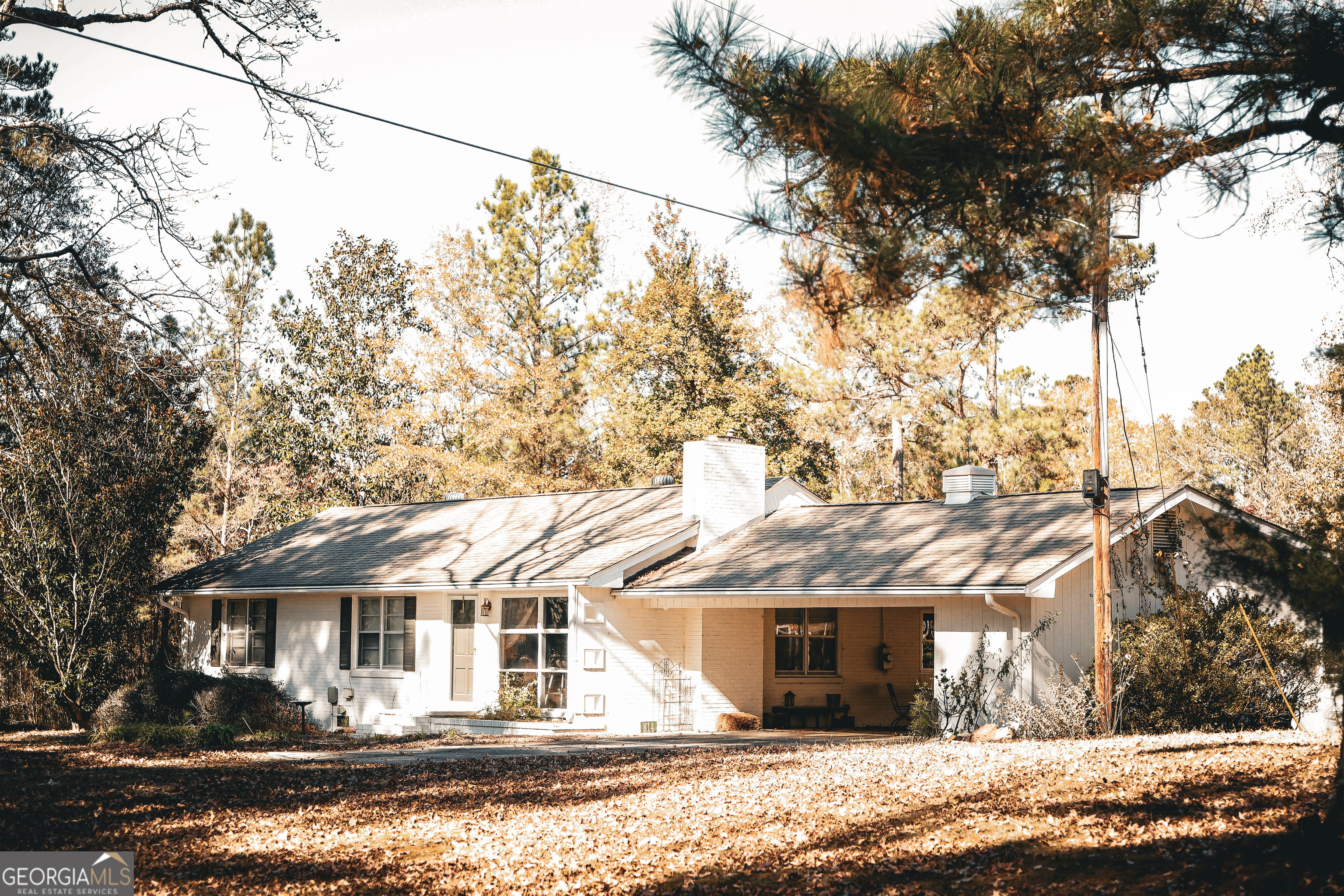 814 Oak Grove Church Road Musella, GA 31066 - Photo 8 of 55 a front view of a house with a yard and garage